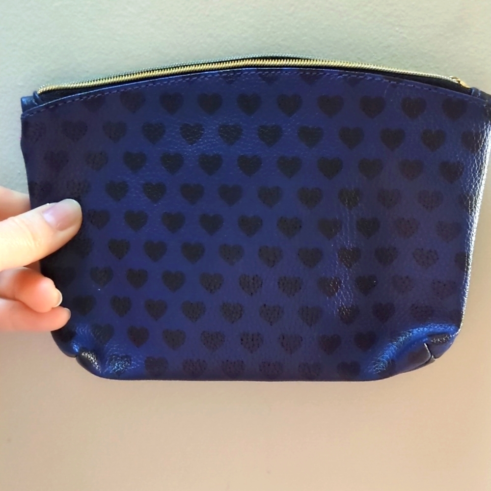Blue and Black hearts ipsy makeup bag with gold zipper. Pink interior.